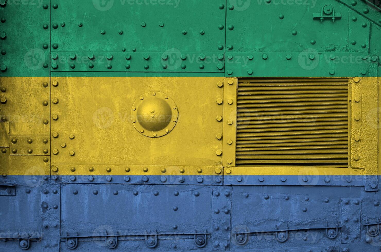 Gabon flag depicted on side part of military armored tank closeup. Army forces conceptual background photo