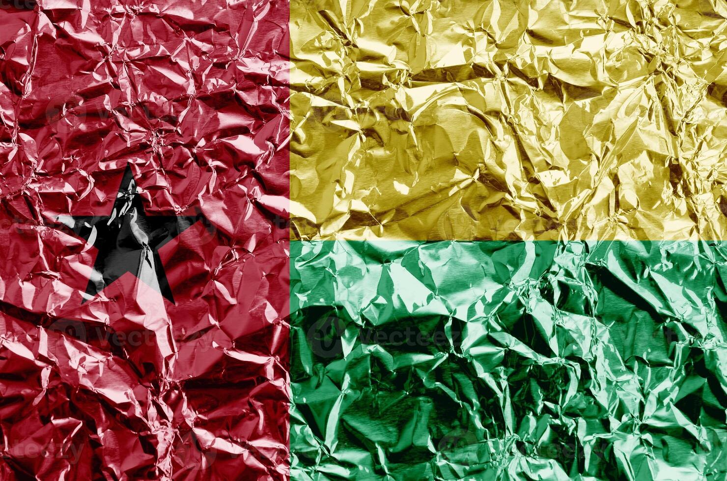 Guinea Bissau flag depicted in paint colors on shiny crumpled aluminium foil closeup. Textured banner on rough background photo