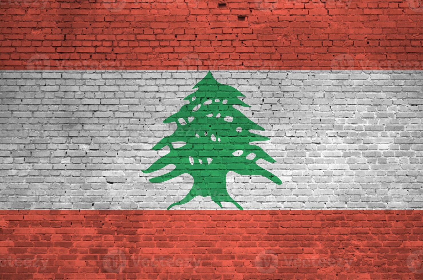 Lebanon flag depicted in paint colors on old brick wall. Textured banner on big brick wall masonry background photo