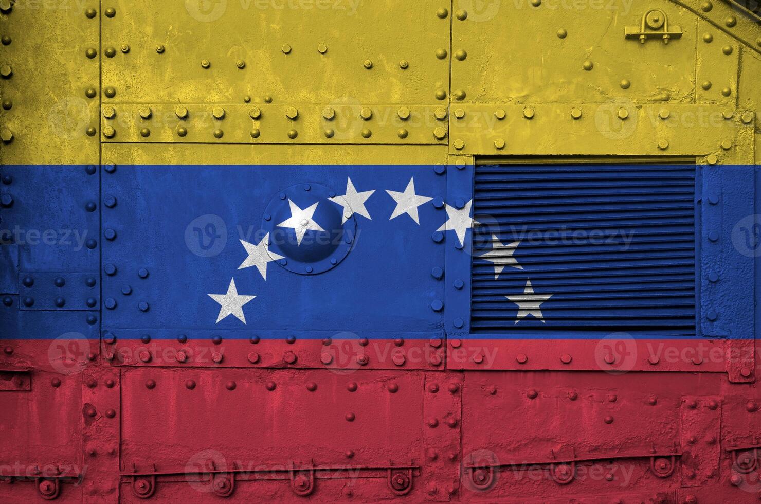 Venezuela flag depicted on side part of military armored tank closeup. Army forces conceptual background photo