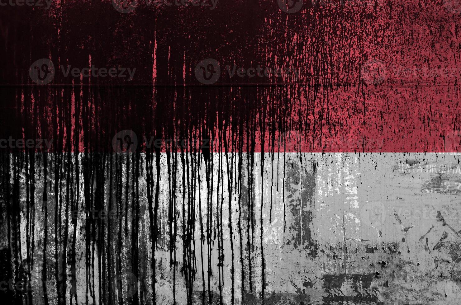 Indonesia flag depicted in paint colors on old and dirty oil barrel wall closeup. Textured banner on rough background photo