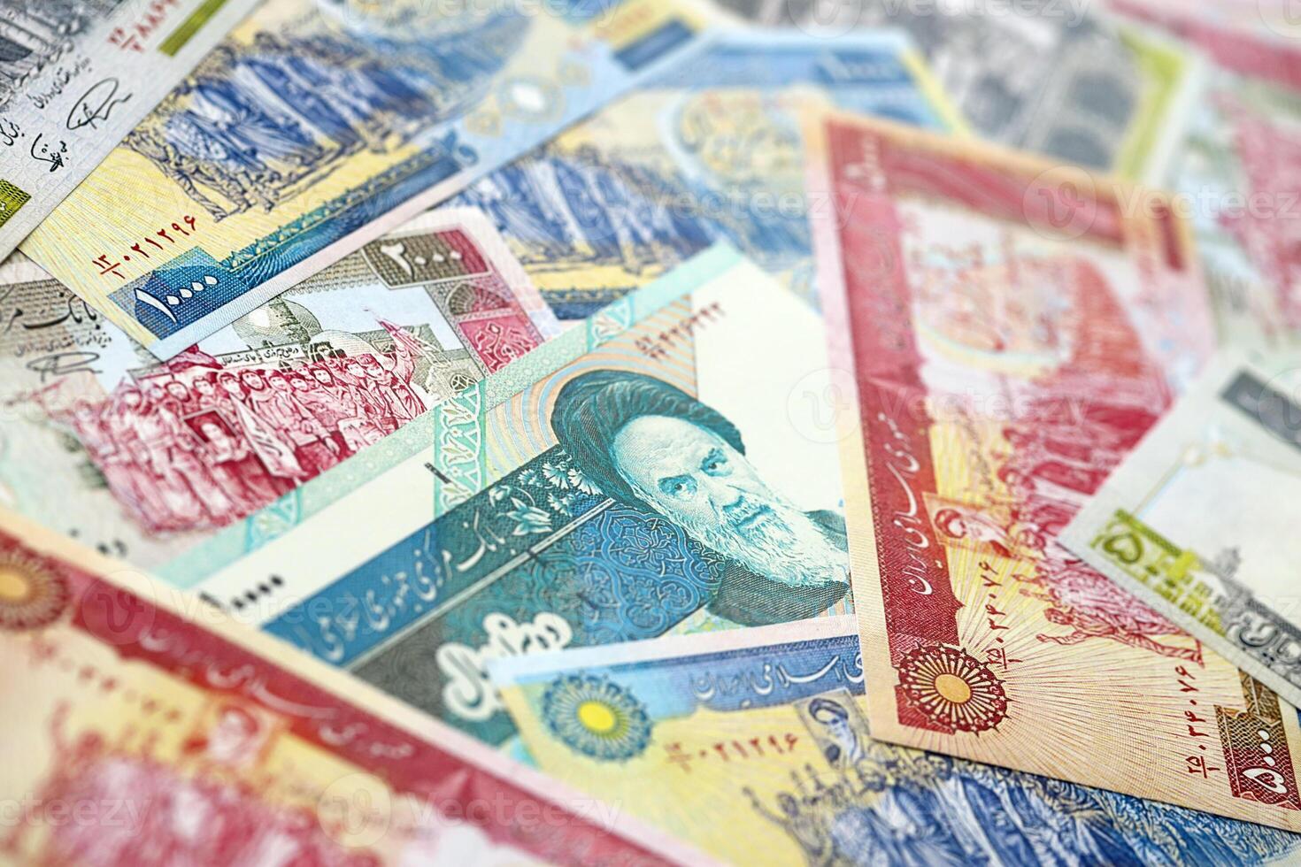 Big pile of Iranian Rial IRR banknotes from Iran as the background on flat surface photo