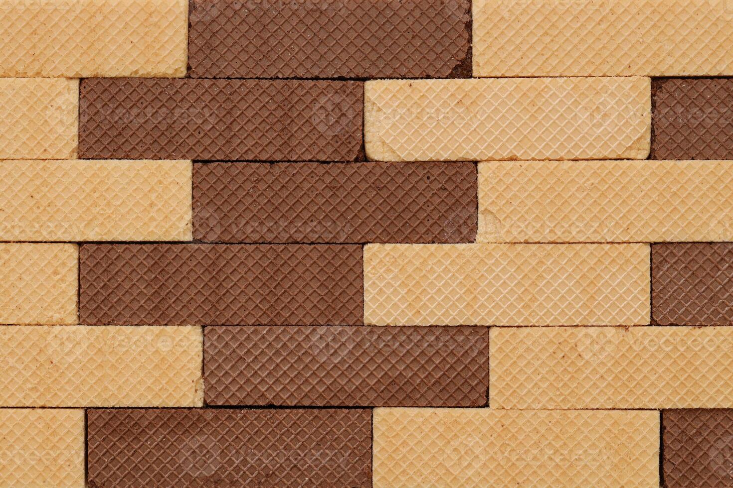 Stacked delicious chocolate wafers in large amount. Two different flavours of classic waffles photo
