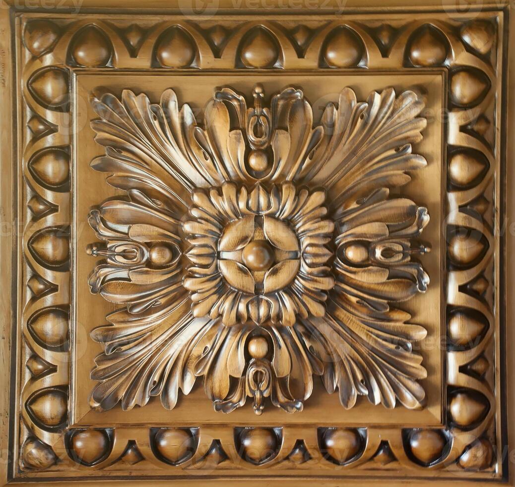 Elegant dark brown ceiling with stone patterns and a rosette texture photo