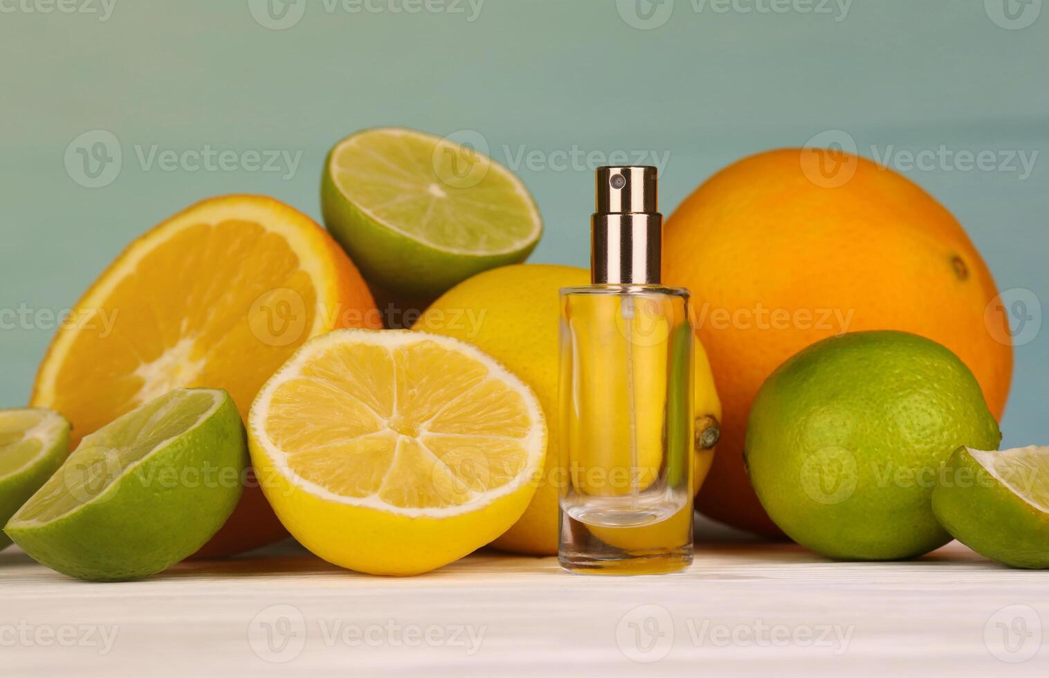 Perfume with citrus extracts. Selective focus. Spa day, concept of freshness perfume bottle with lemon lime and orange photo
