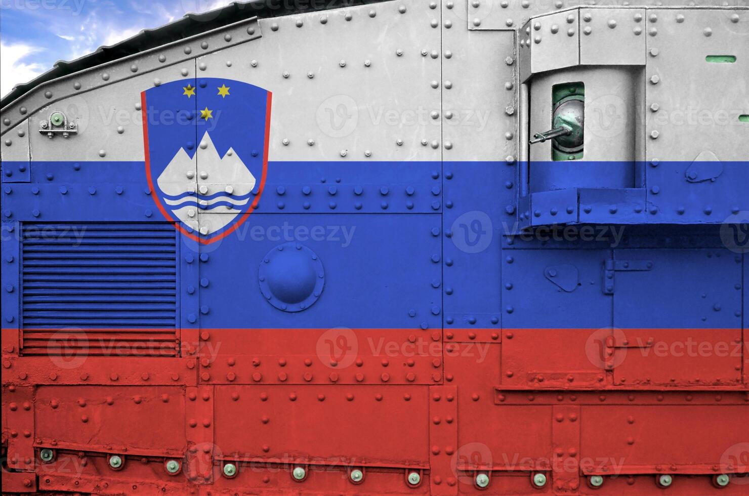 Slovenia flag depicted on side part of military armored tank closeup. Army forces conceptual background photo