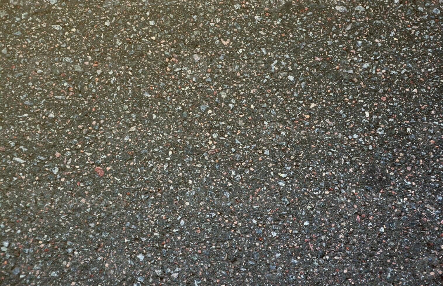 Surface grunge rough of asphalt. Tarmac dark grey grainy road. Texture Background Top view photo