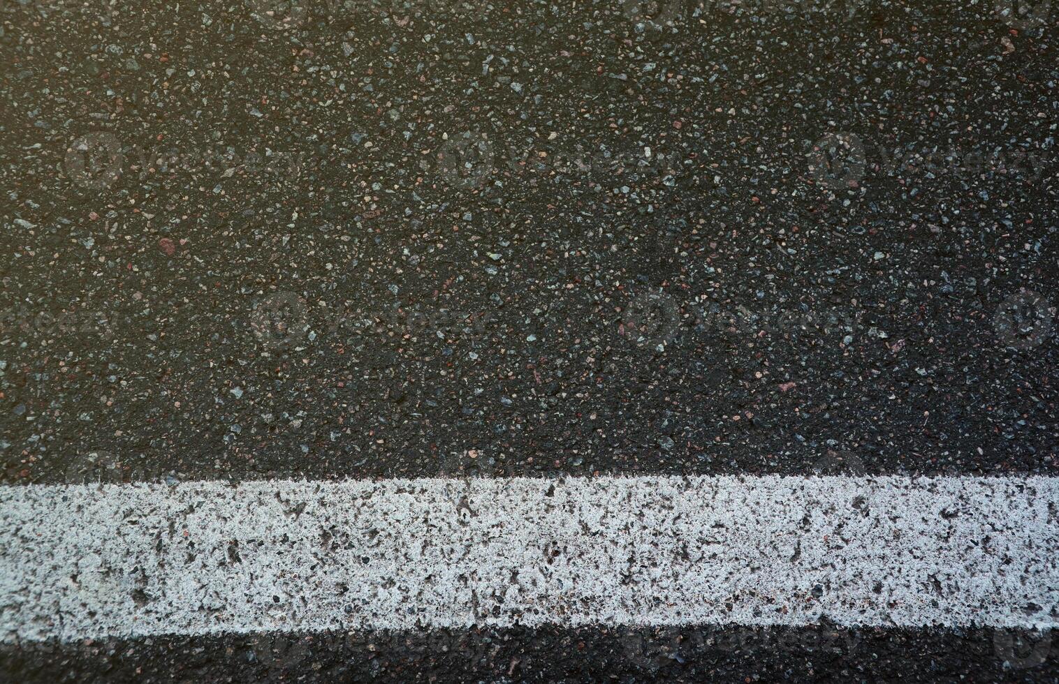 Surface grunge rough of asphalt. Tarmac dark grey grainy road. Texture Background Top view photo
