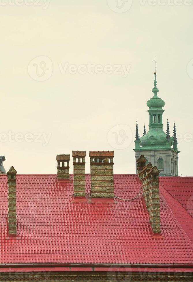 Fragment of a metal roof of the restored old multi-storey building in Lviv, Ukraine photo