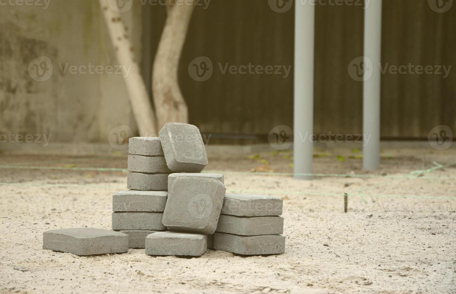 Small pile of gray walkway slabs lying in stack outdoors. Material for Paving Slabs by mosaic in progress. Cobblestone installation photo
