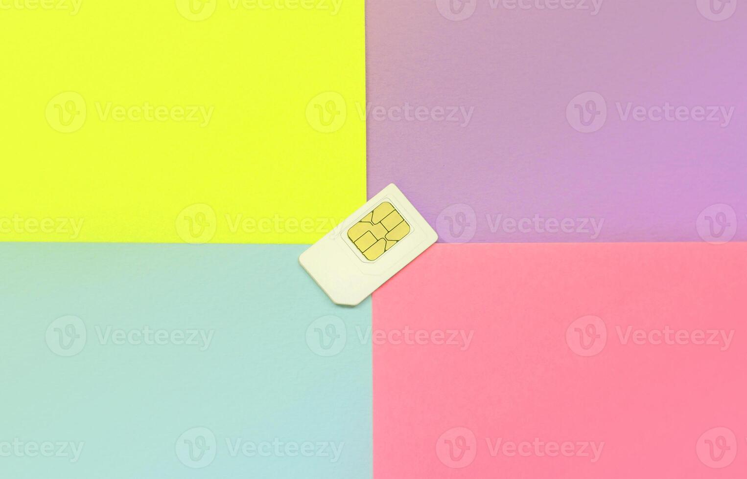 Subscriber identity module. White SIM card on pastel background photo