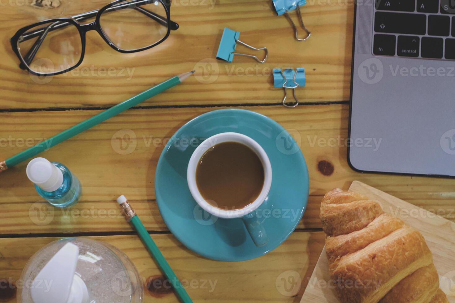Women using laptop working and clean hands with alcohol drink coffee cup hot at home photo
