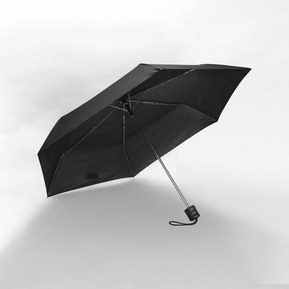 Opened umbrella isolated on white background with clipping path. Umbrella with handle for mock up. copy space, design template for mock-up, branding, advertise etc. Studio Photography shoot photo