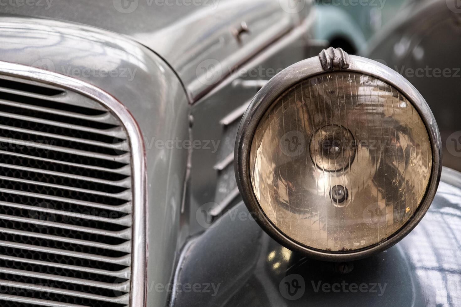 Headlight of old vintage car photo