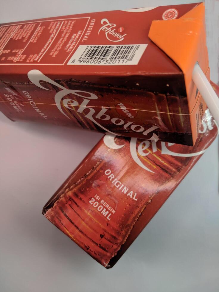 Sulawesi, Indonesia, January 21st, 2023. Sosro bottle tea, packaged tea drink, one of the popular drink brands in Indonesia in a red box. Sometimes served during Ramadan or Eid al-Fitr photo