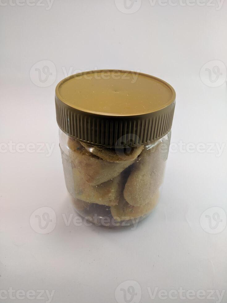 A view of the traditional cake of Ramadan or after the Eid al-Fitr holiday in Indonesia made from nuts as the main ingredient is seen in a bowl on a white background photo