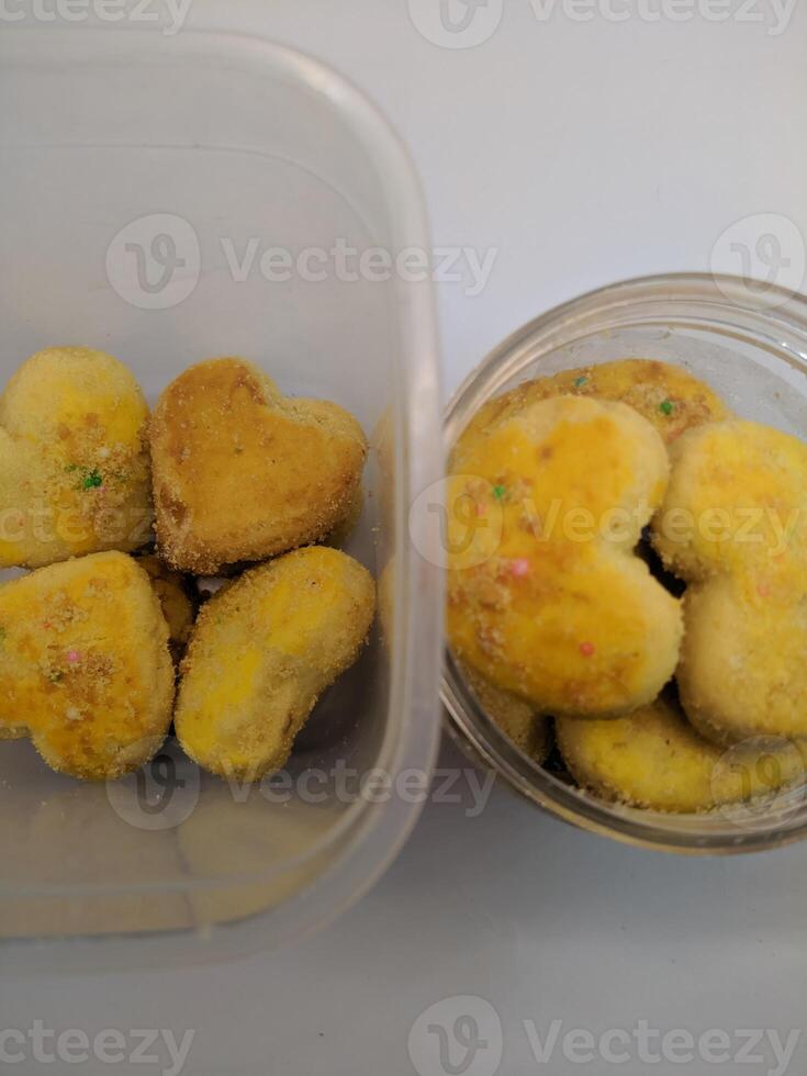 A view of the traditional cake of Ramadan or after the Eid al-Fitr holiday in Indonesia made from nuts as the main ingredient is seen in a bowl on a white background photo