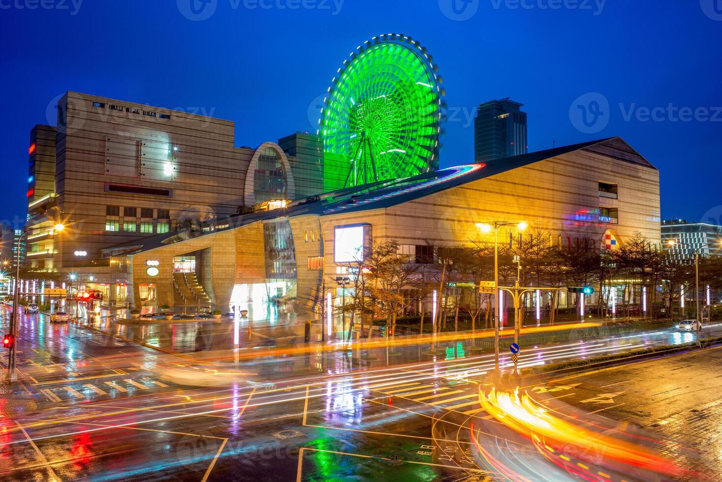 night view of Taipei city with ferris wheel photo