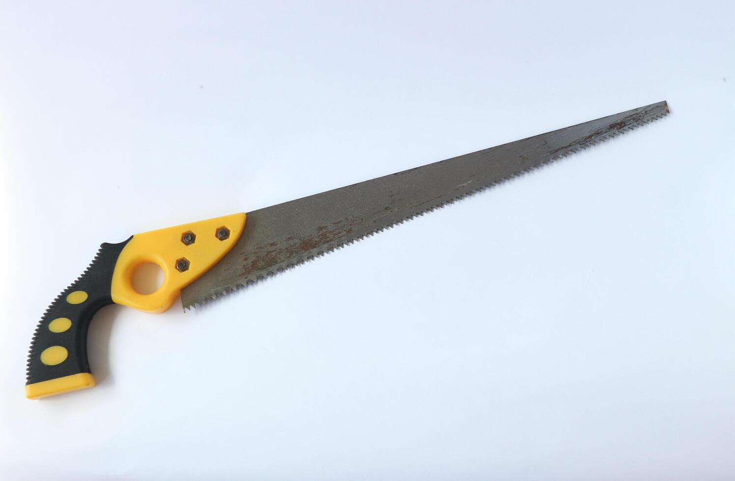 Hand saw with yellow plastic handle photo