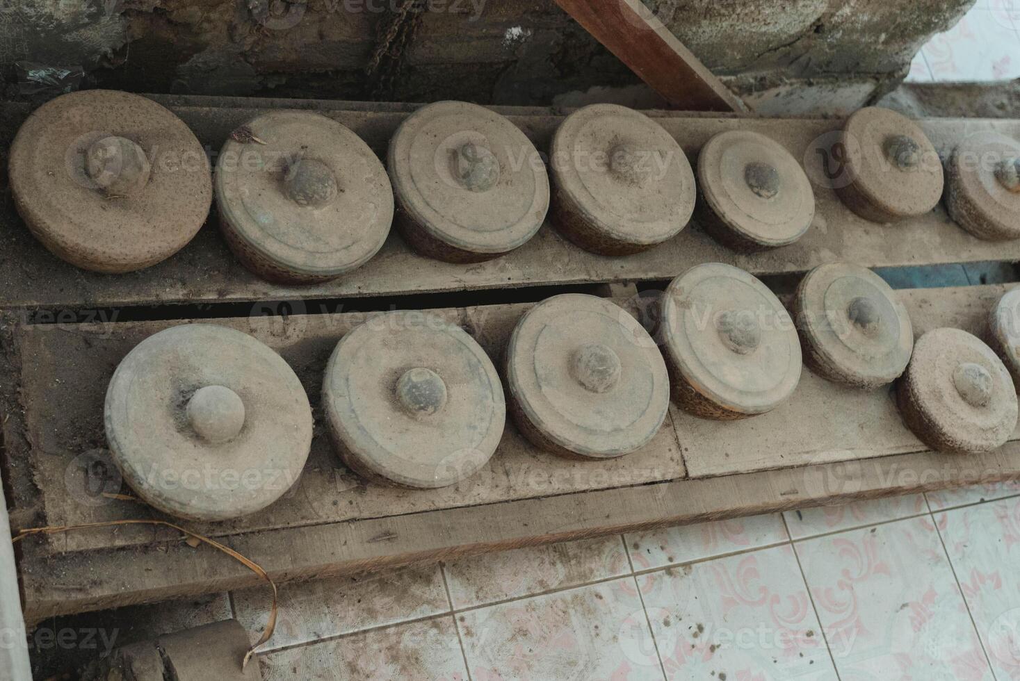 Old and rustic metal Gamelan, traditional balinese percussive music instruments for ensemble music, traditional music in Bali and Java, Indonesia. photo