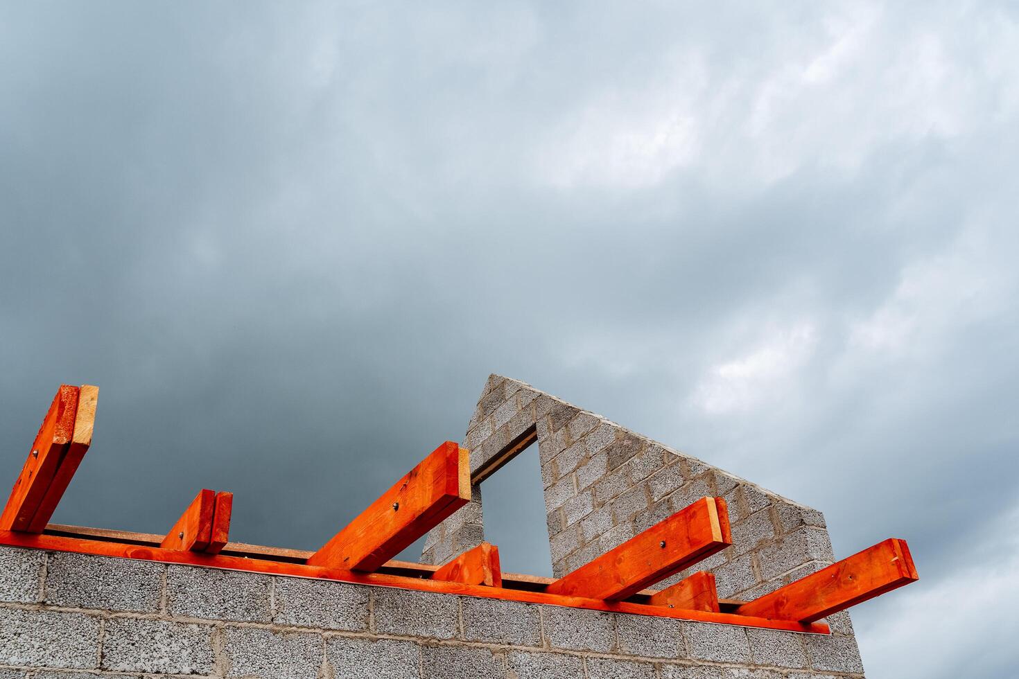 red wooden floor beams of house construction, house construction, construction work photo