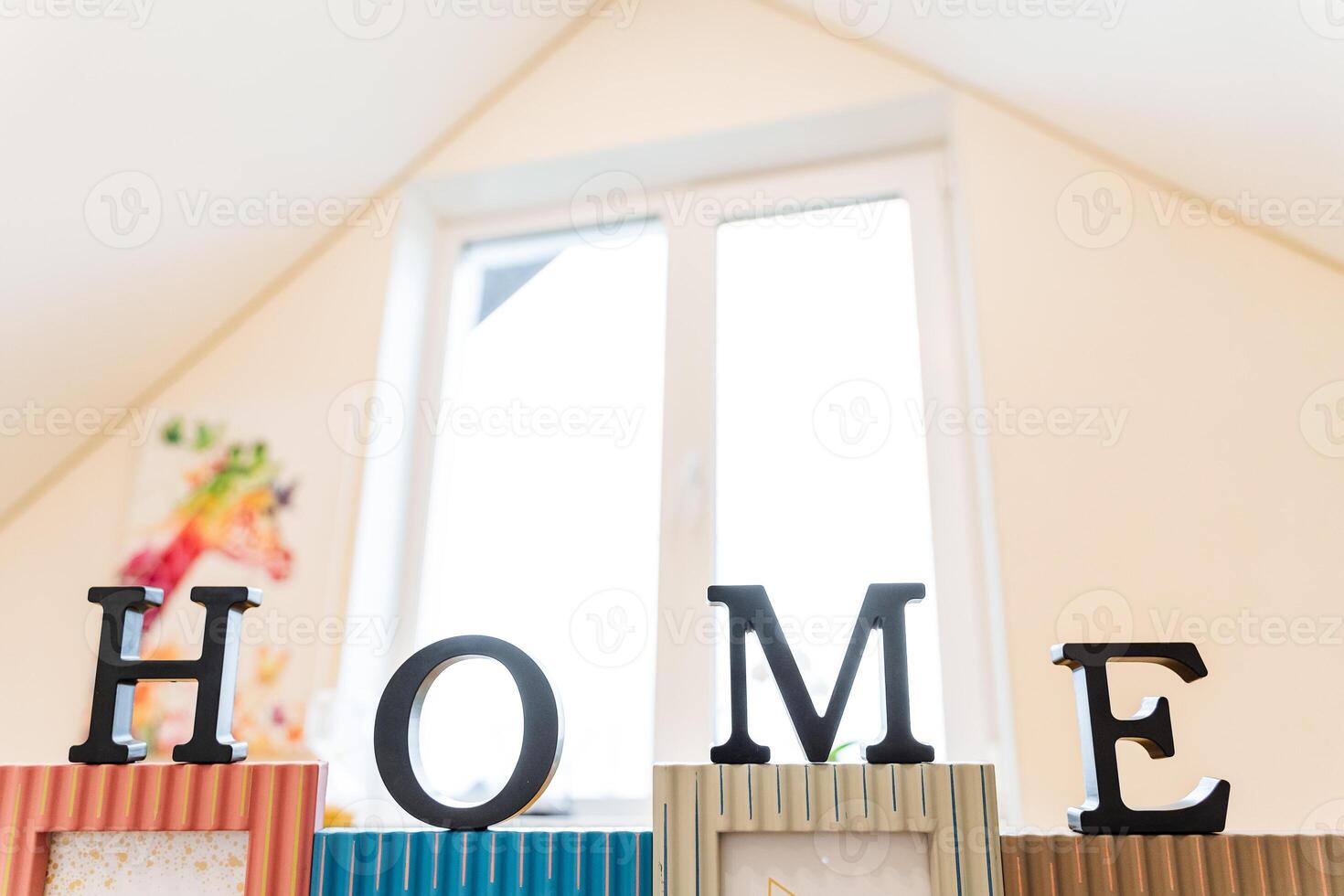 the word house is photographed close-up against a window, the inscription house, macro photography, blurred background photo