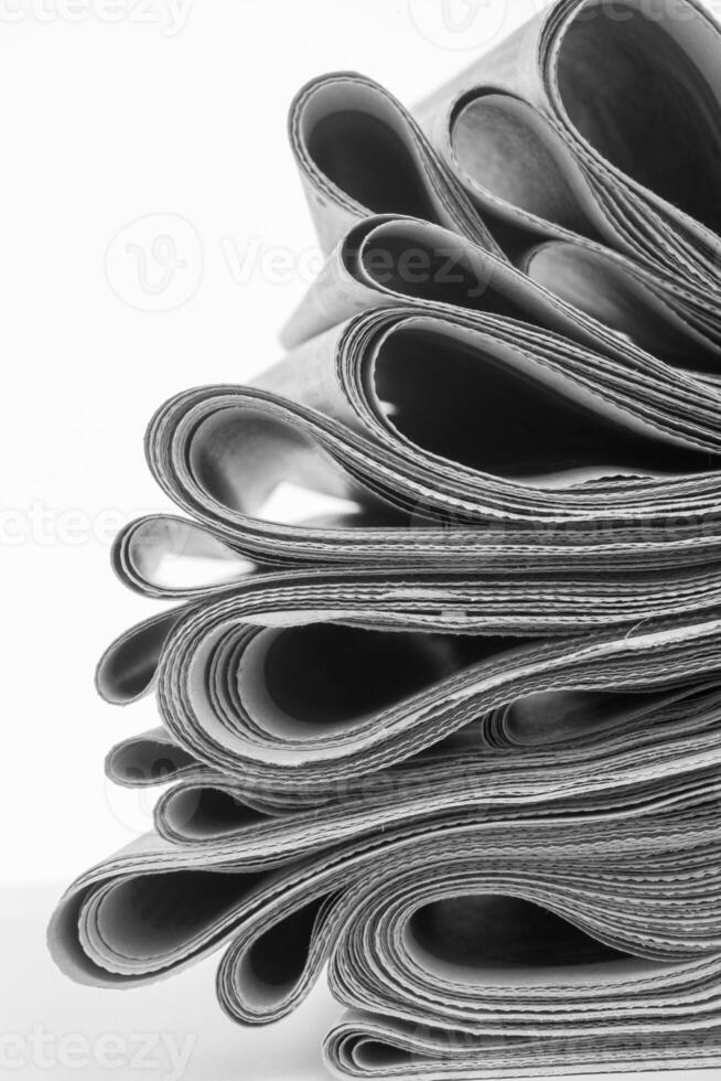 Newspapers folded and stacked photo