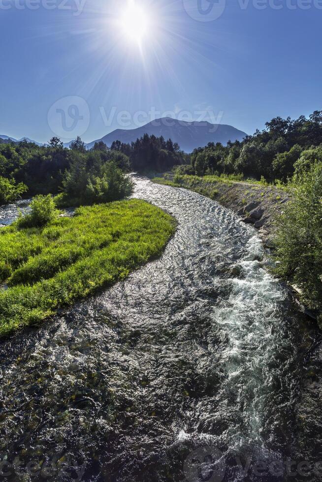 River in mountain valley photo