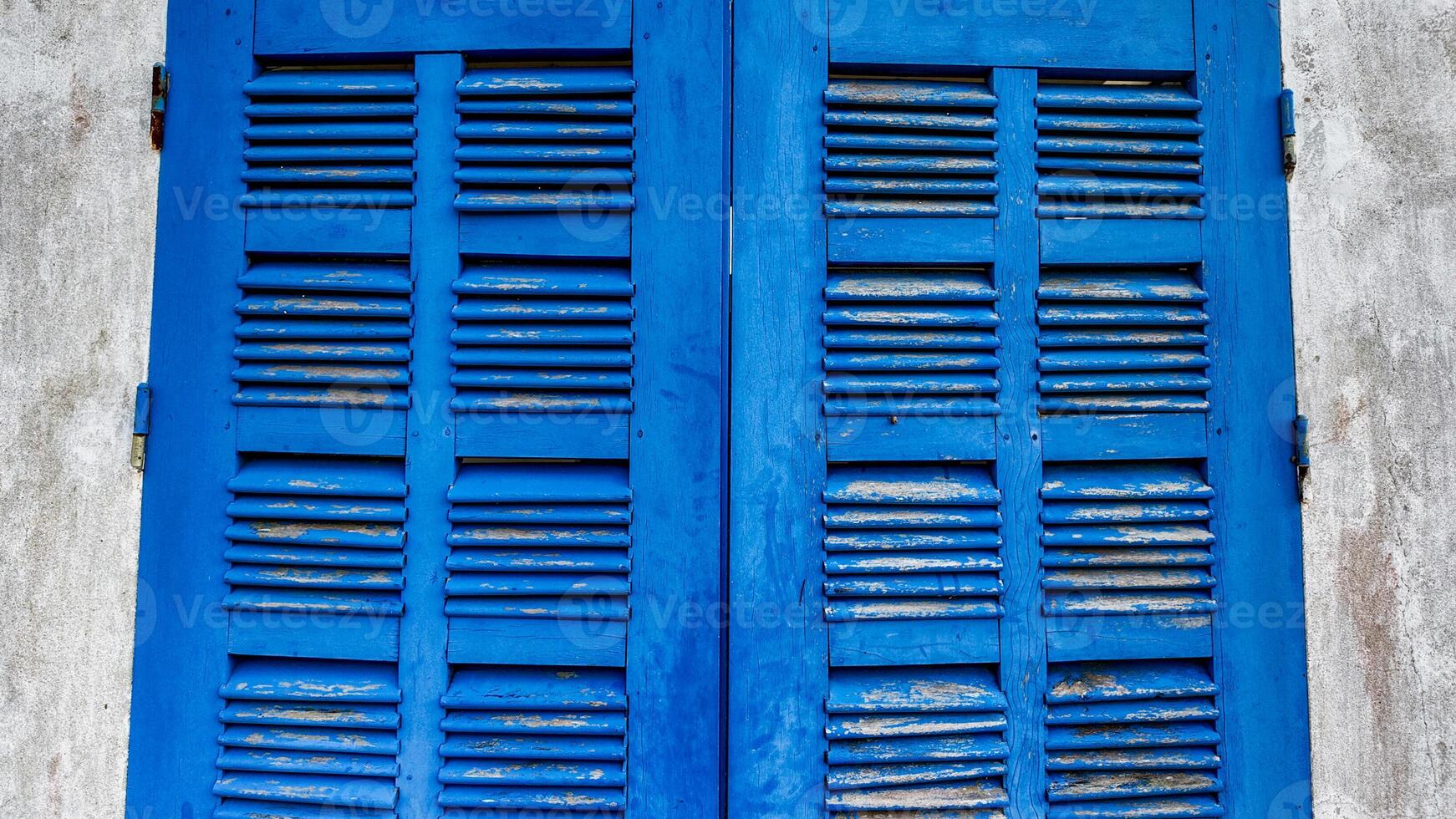 Vintage Blue Shutters on Grey Wall photo