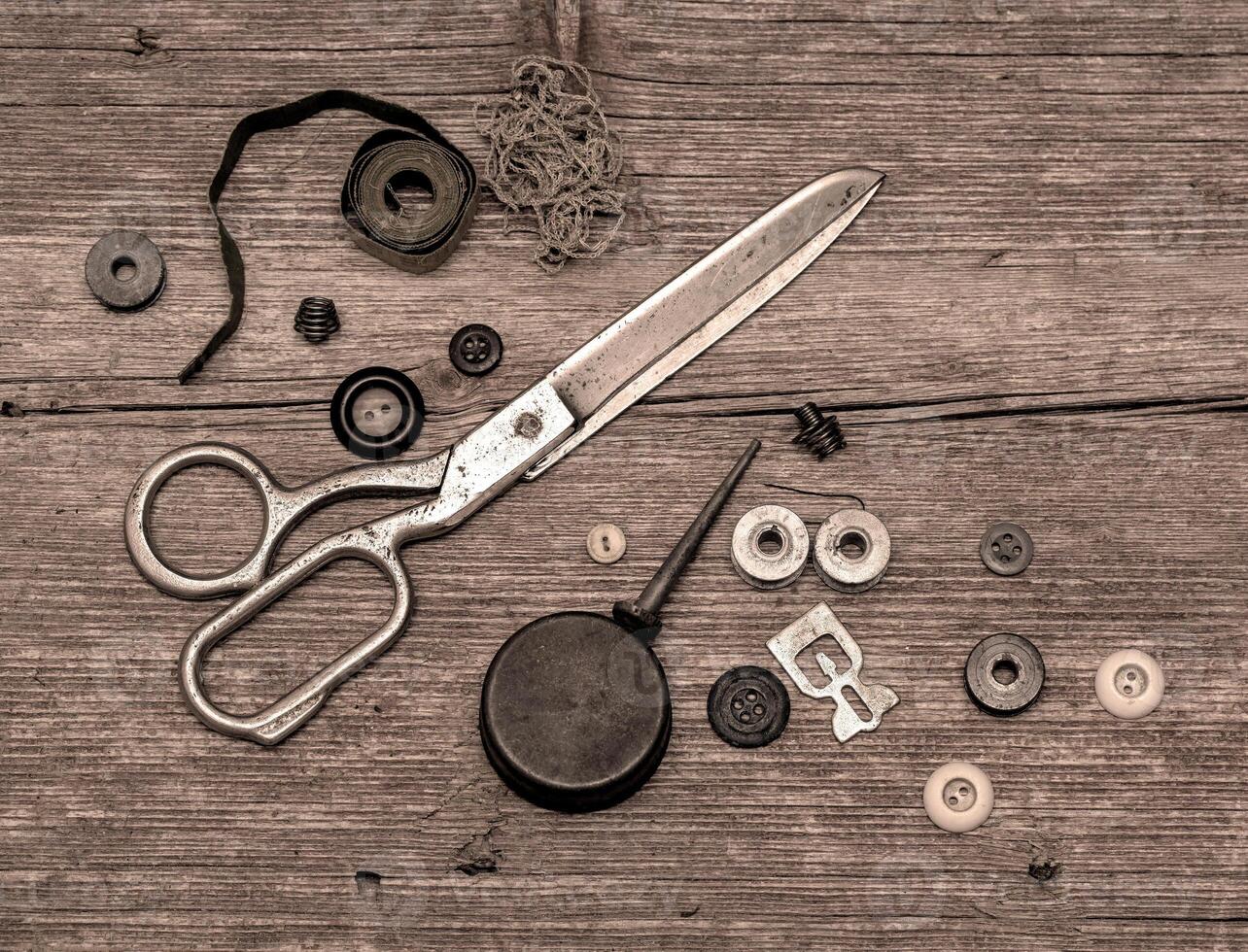 Old scissors and buttons photo