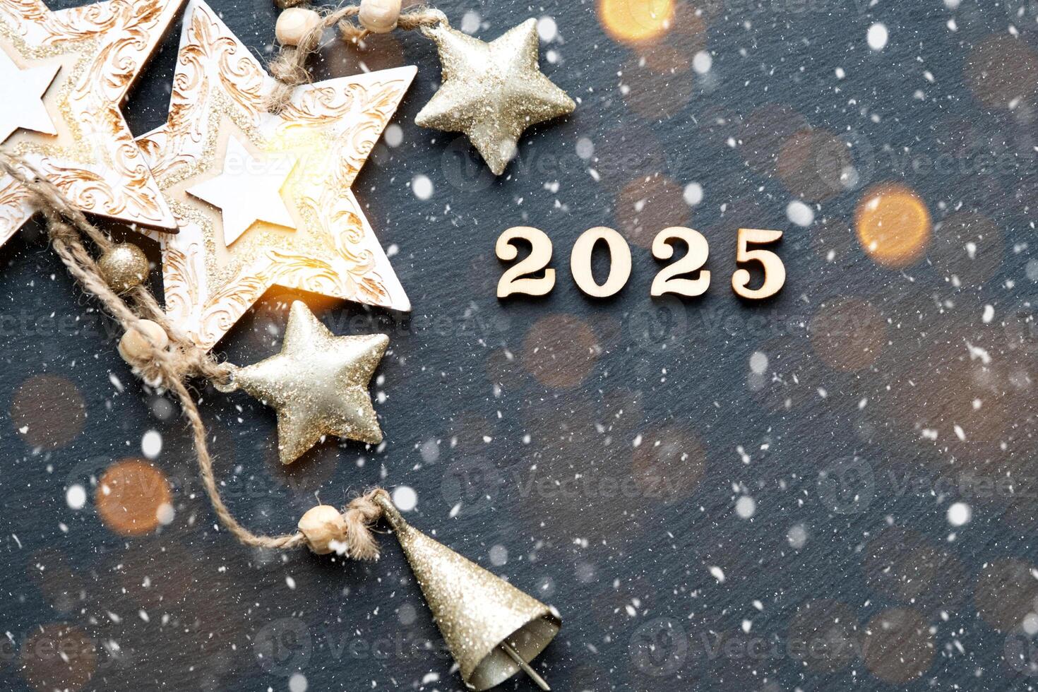 Happy New Year-wooden letters and the numbers 2025 on festive black background with sequins, stars, snow. Greetings, postcard. Calendar, cover photo