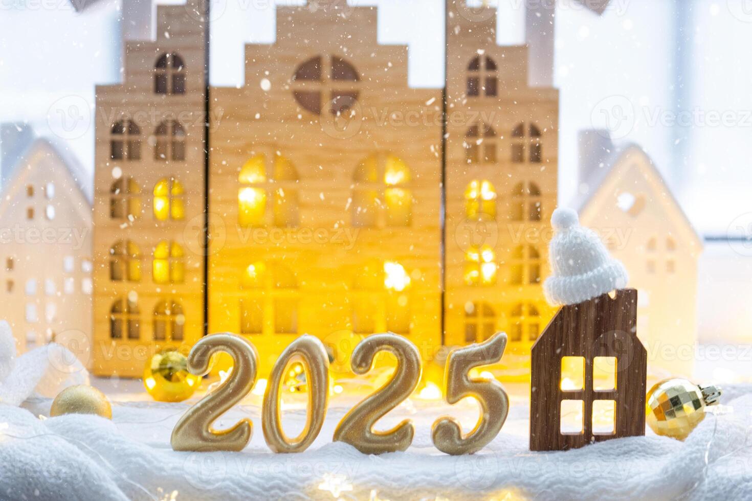 Golden figures number 2025 and tiny home on background of cozy windows of a house with warm light with festive decor of stars,snow and garlands. Greeting card, Happy New Year, cozy home photo