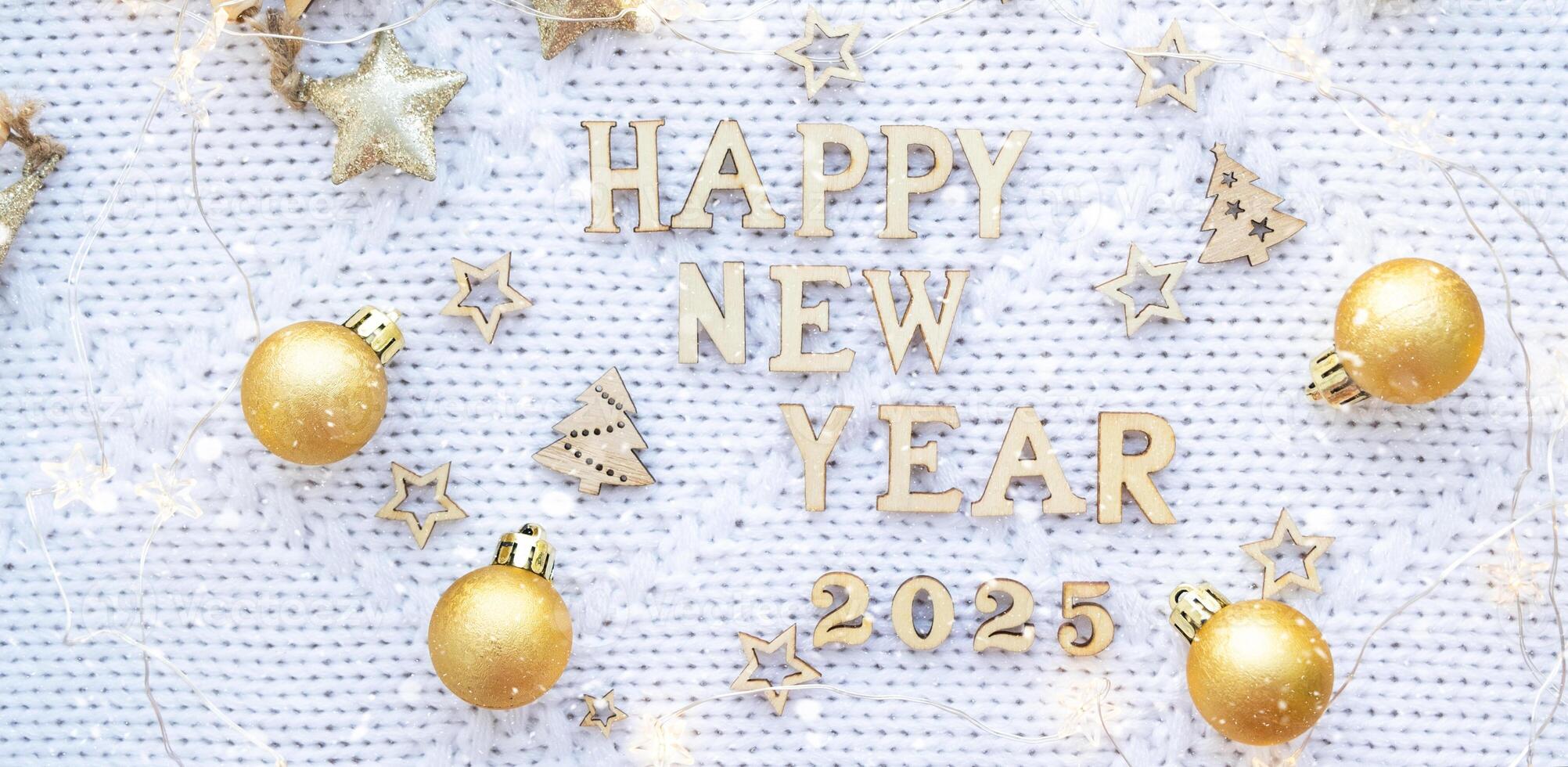 Happy New Year wooden numbers 2025 on cozy festive white knitted background with sequins, stars, lights of garlands. Greetings, postcard. Calendar, cover photo