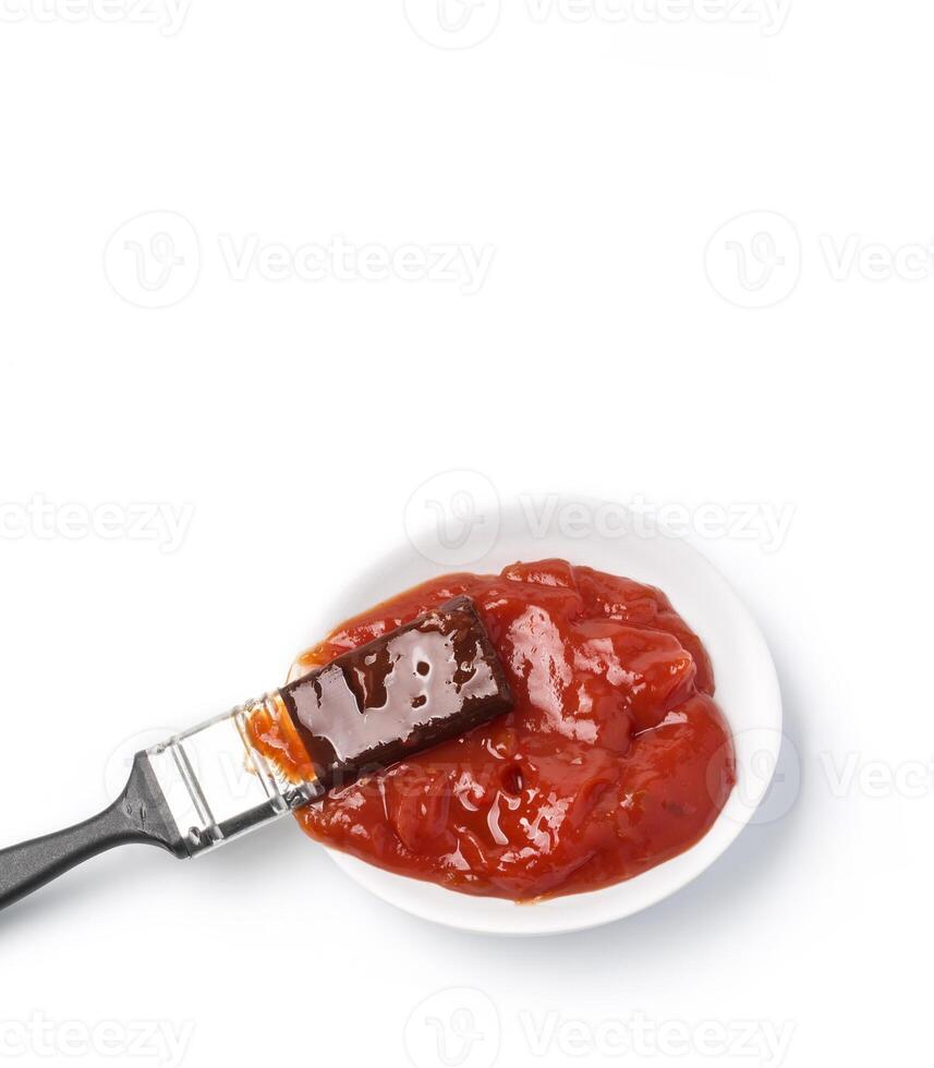 Barbecue sauce and basting brush photo