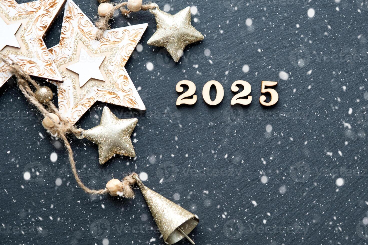 Happy New Year-wooden letters and the numbers 2025 on festive black background with sequins, stars, snow. Greetings, postcard. Calendar, cover photo