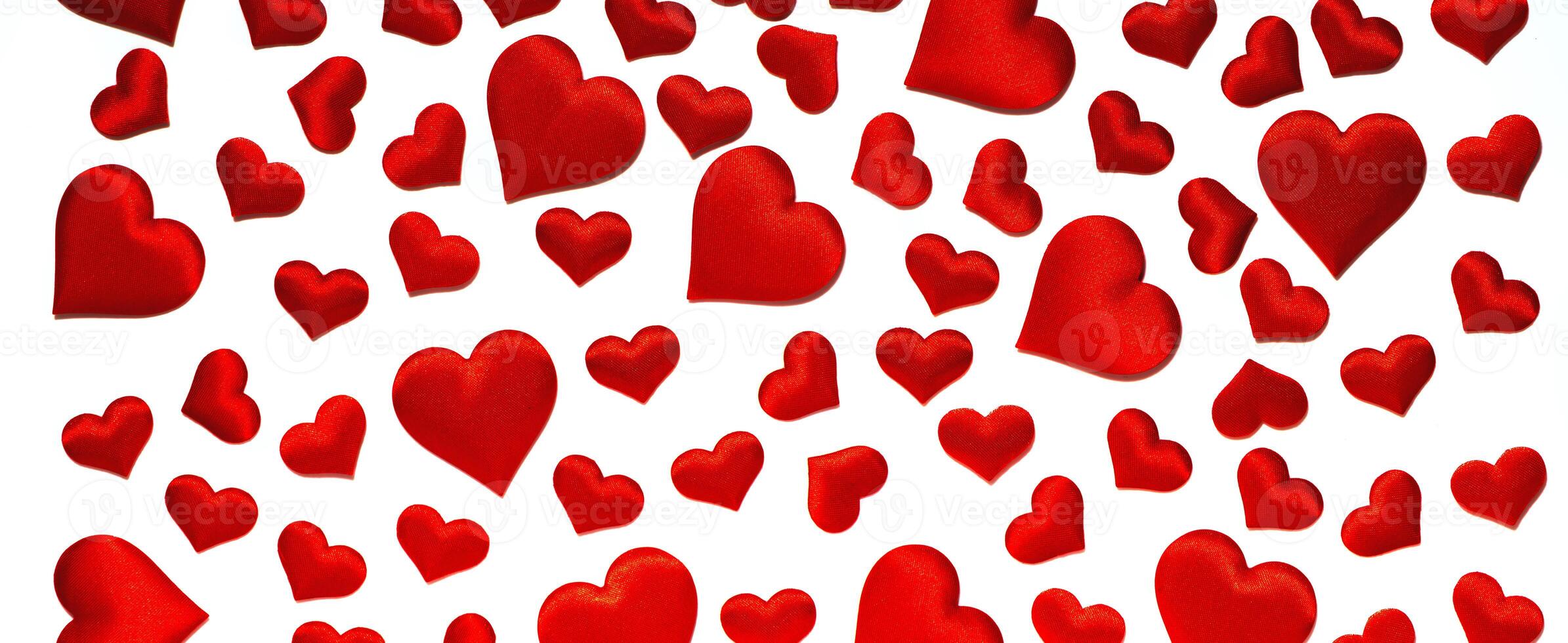 Red hearts on a white background. Isolated on white. Background for a postcard photo