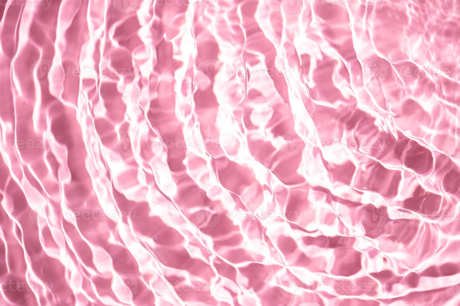 Beautiful water texture with waves. pink color, water background photo