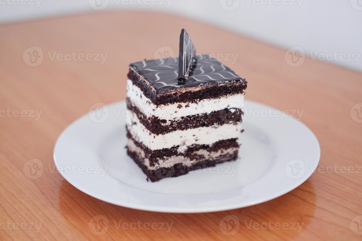 Delicious chocolate cake on a white plate photo