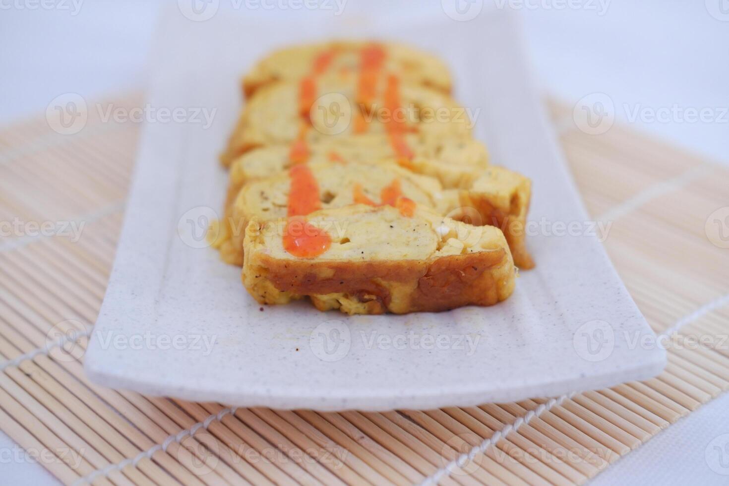 Slices of omelet on a plate photo