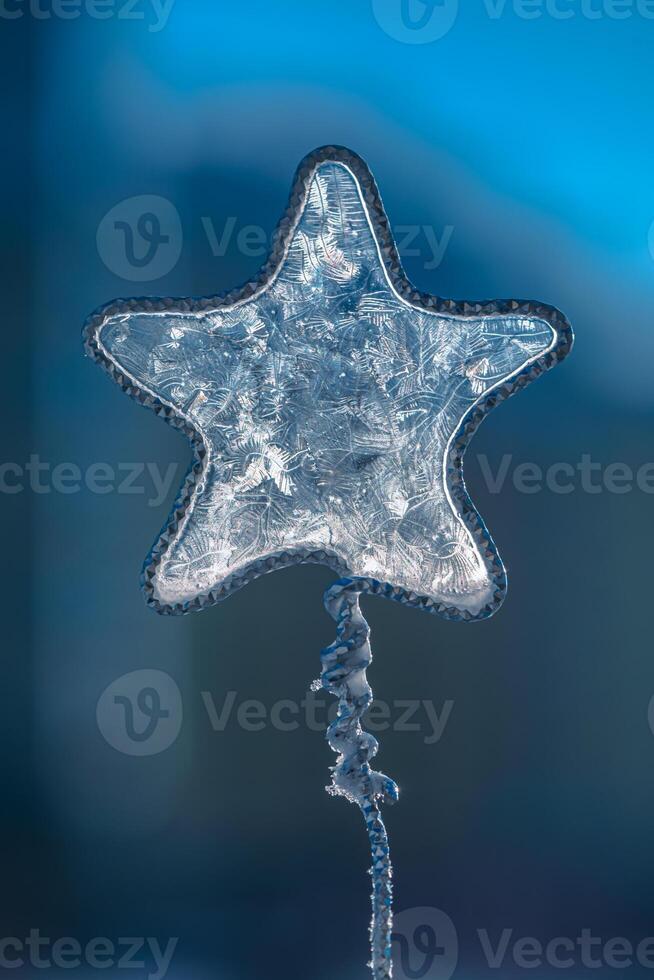 concept winter, frost. beautiful frosty patterns on a star shape, soap bubbles, freezing photo