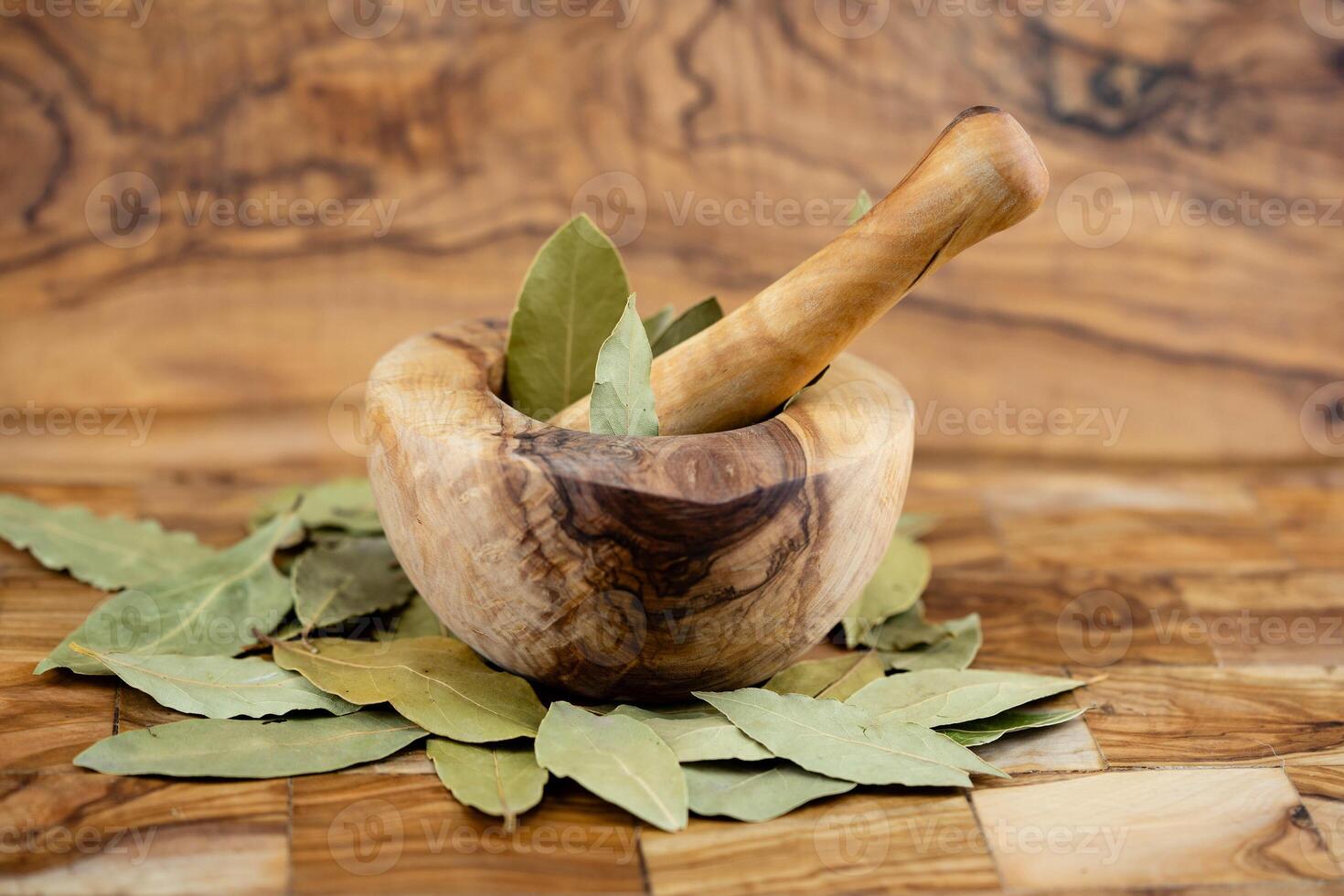 Bay leaves and on olive wood photo