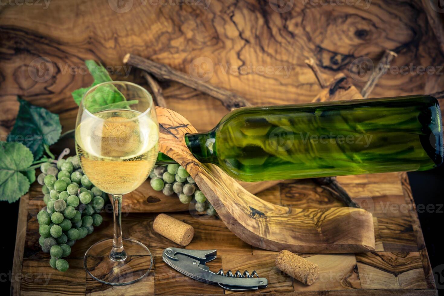 white wine grapes on olive wood photo