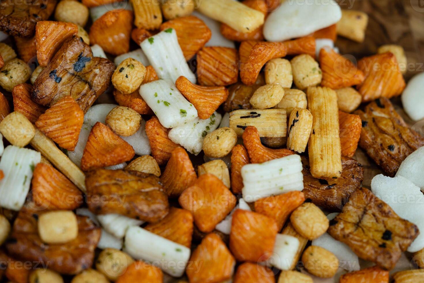 Different types of Japanese rice cakes on olive wood photo