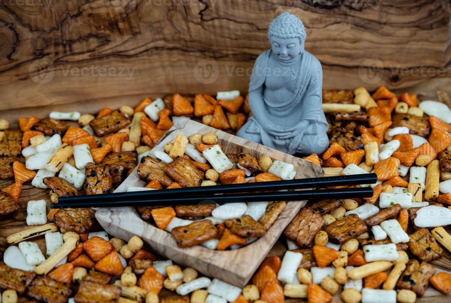 Different types of Japanese rice cakes on olive wood photo