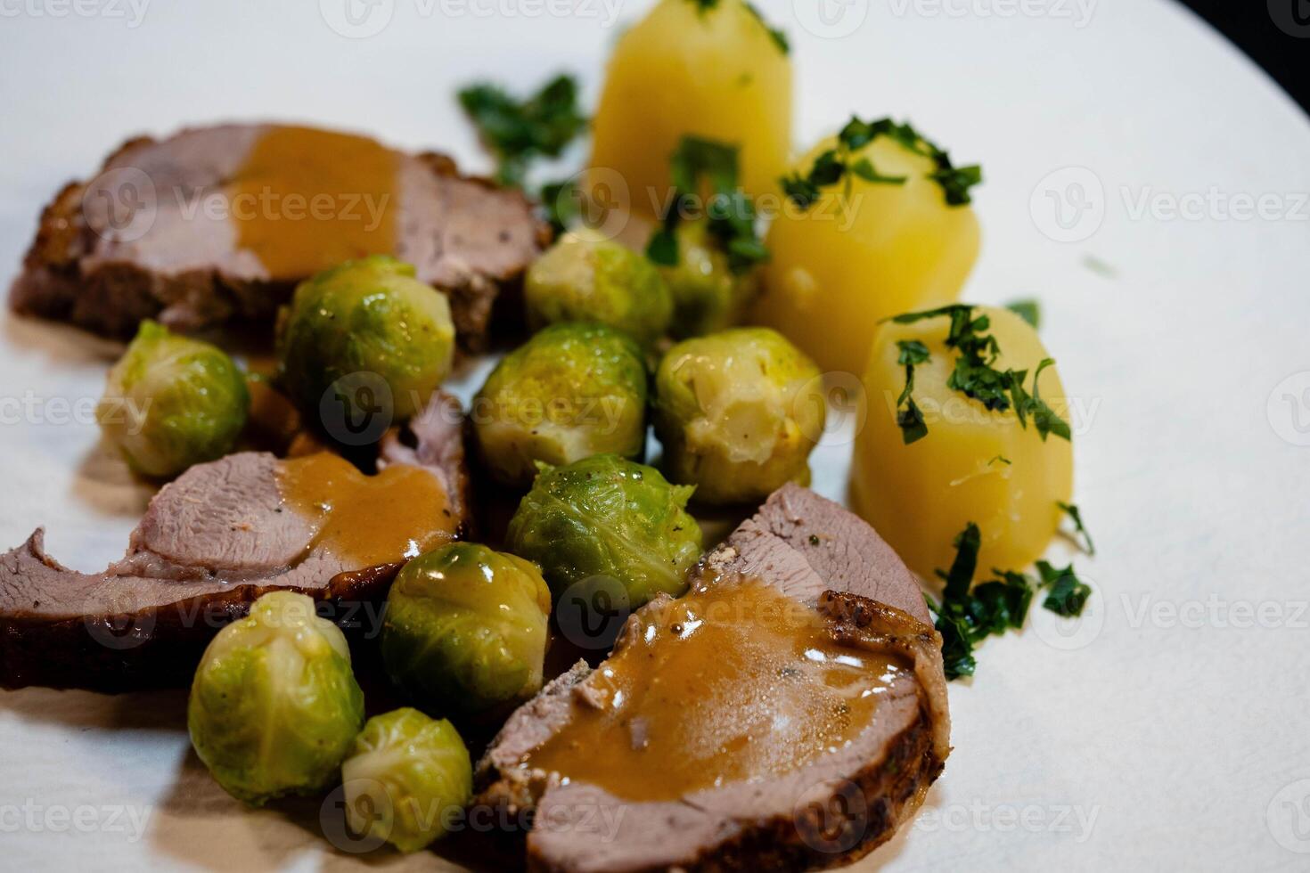 Roast turkey with Brussels sprouts potatoes and gravy photo