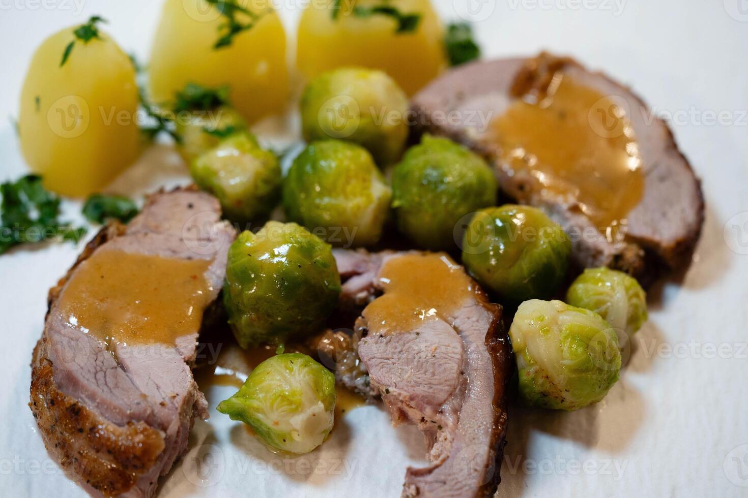 Roast turkey with Brussels sprouts potatoes and gravy photo