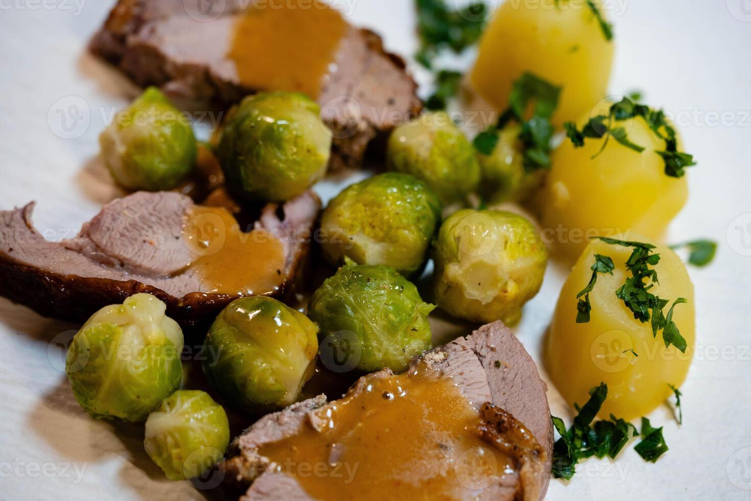 Roast turkey with Brussels sprouts potatoes and gravy photo