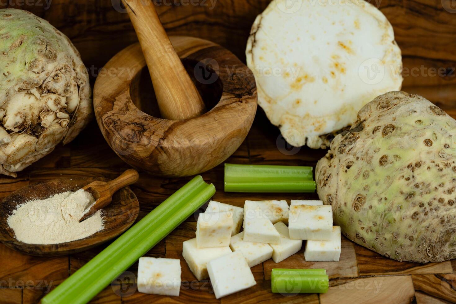 Fresh celery Apium graveolens on olive wood photo