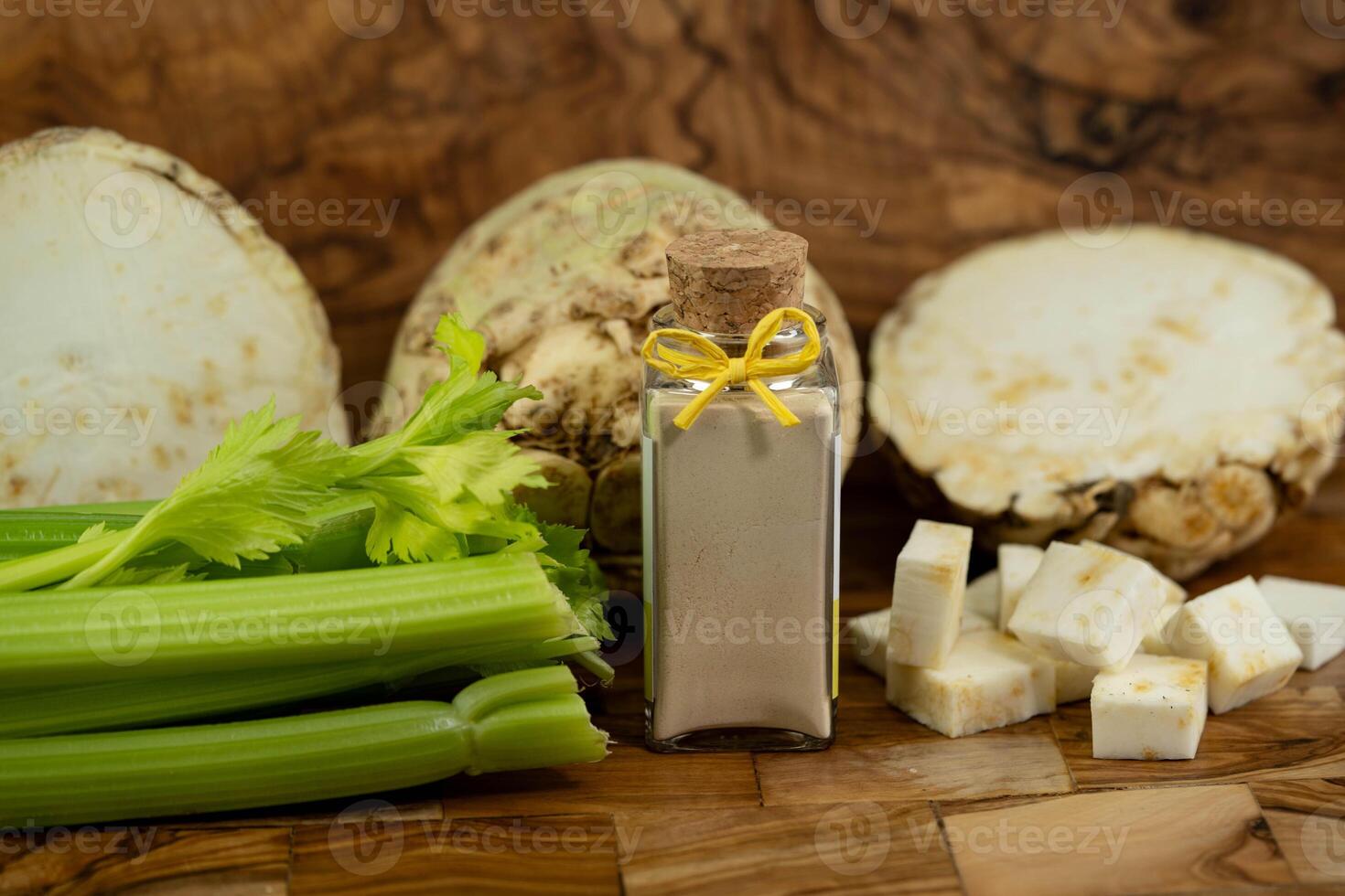 Fresh celery Apium graveolens on olive wood photo