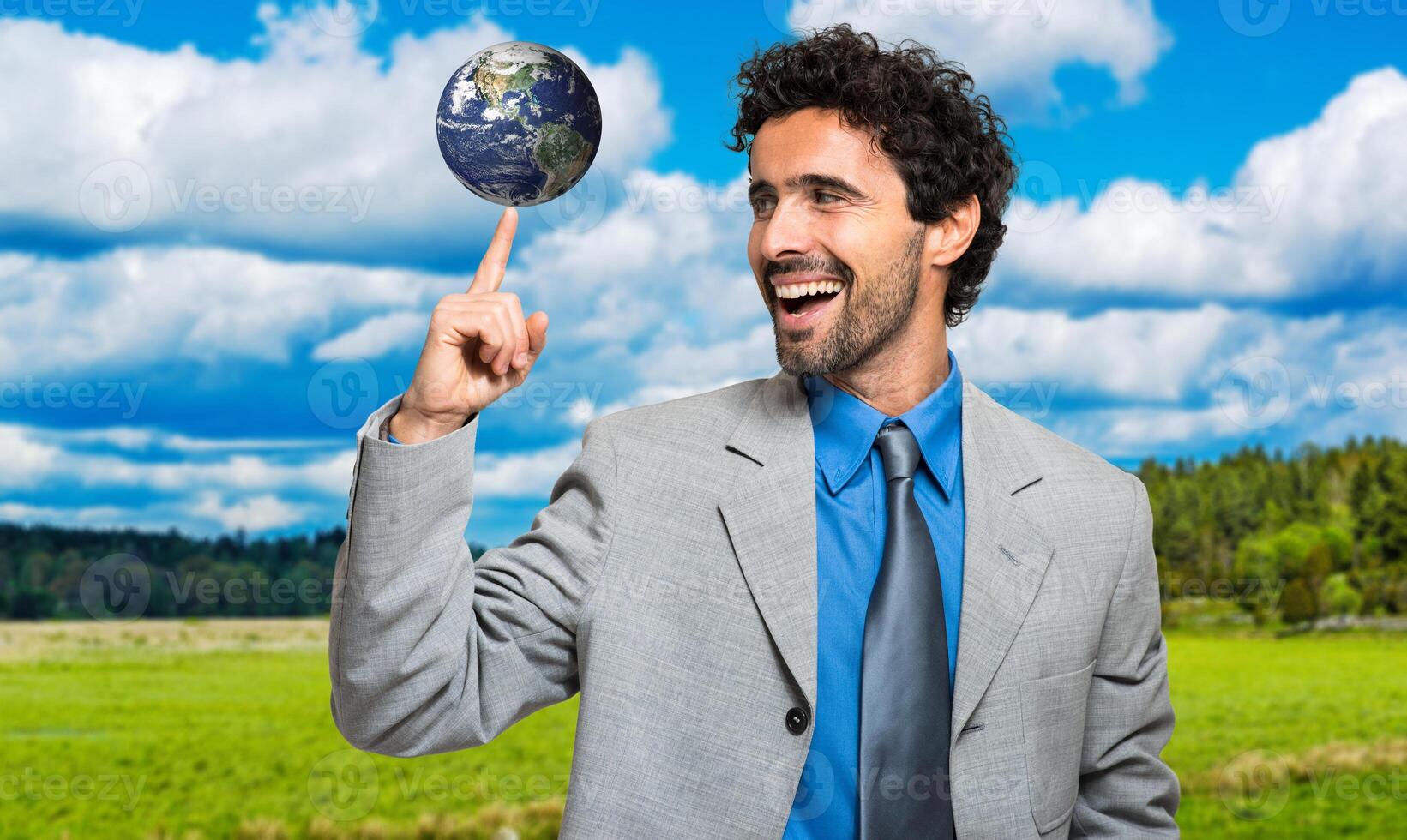 Manager holding the planet on his finger photo